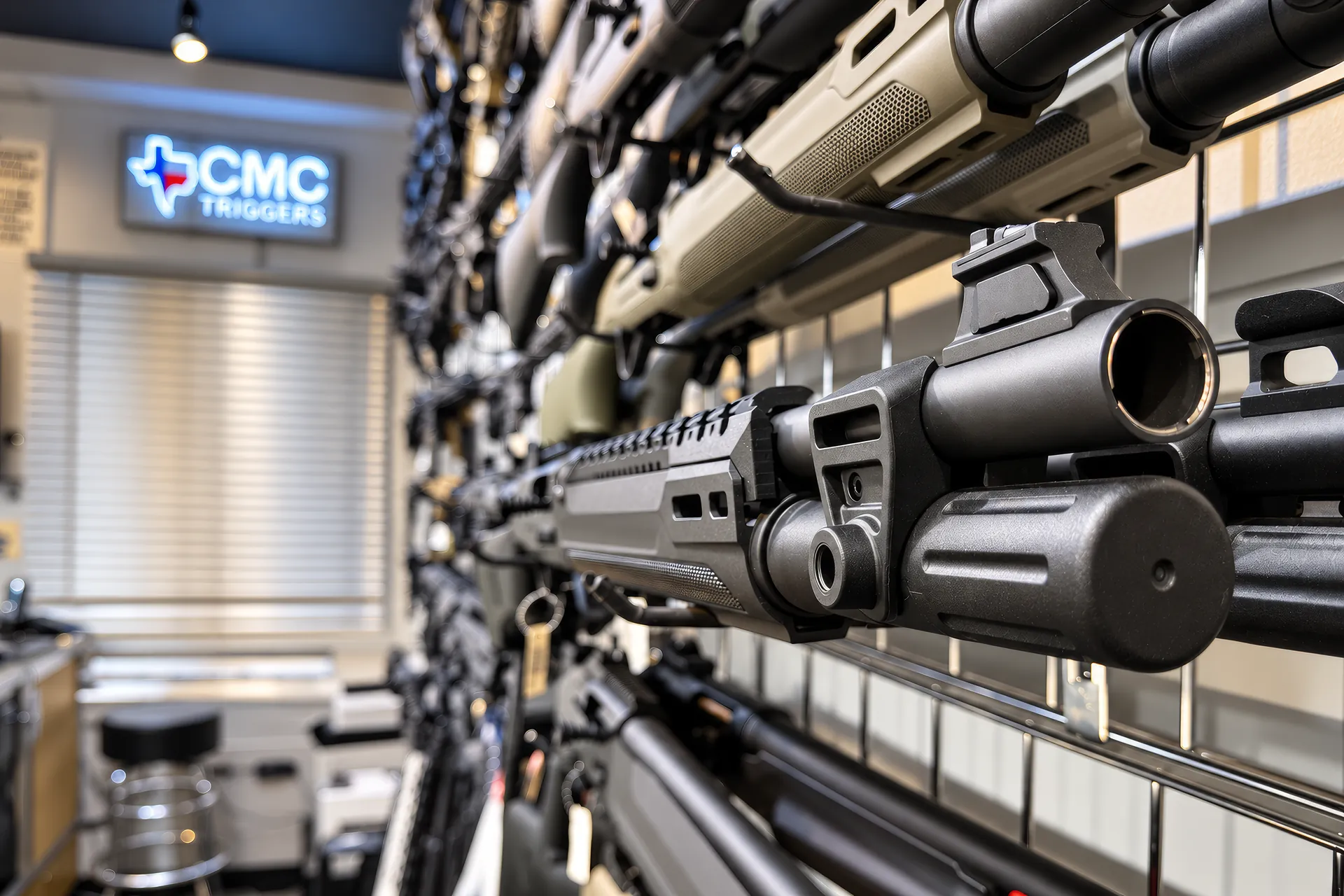 Rifles and optics along the wall at Burbank Ammo and Guns